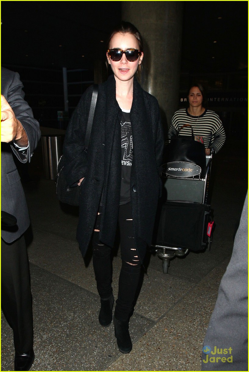 lily collins arrives lax after quick trip 03