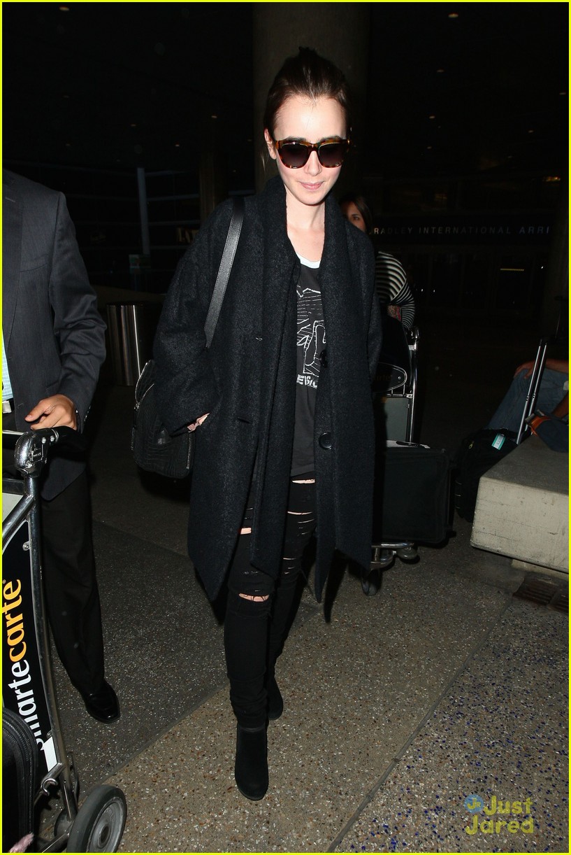 lily collins arrives lax after quick trip 06