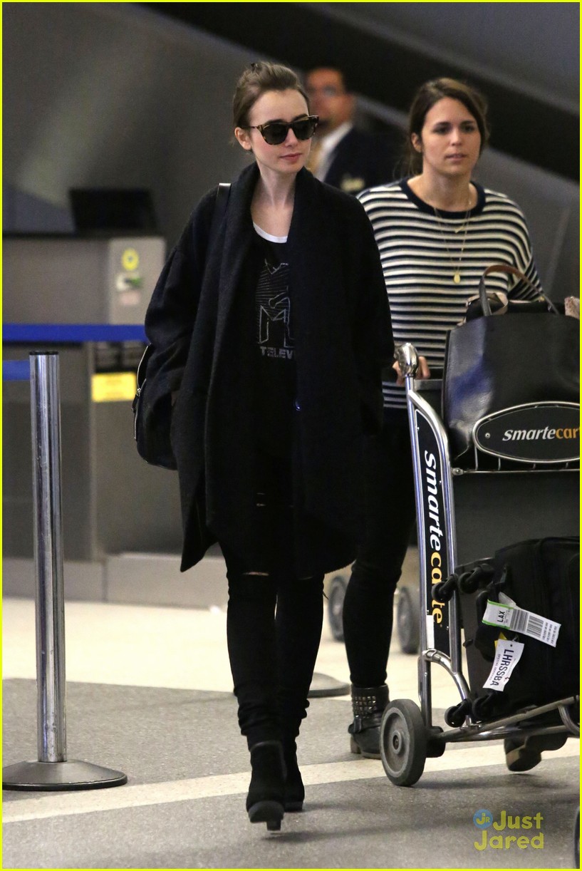 lily collins arrives lax after quick trip 07