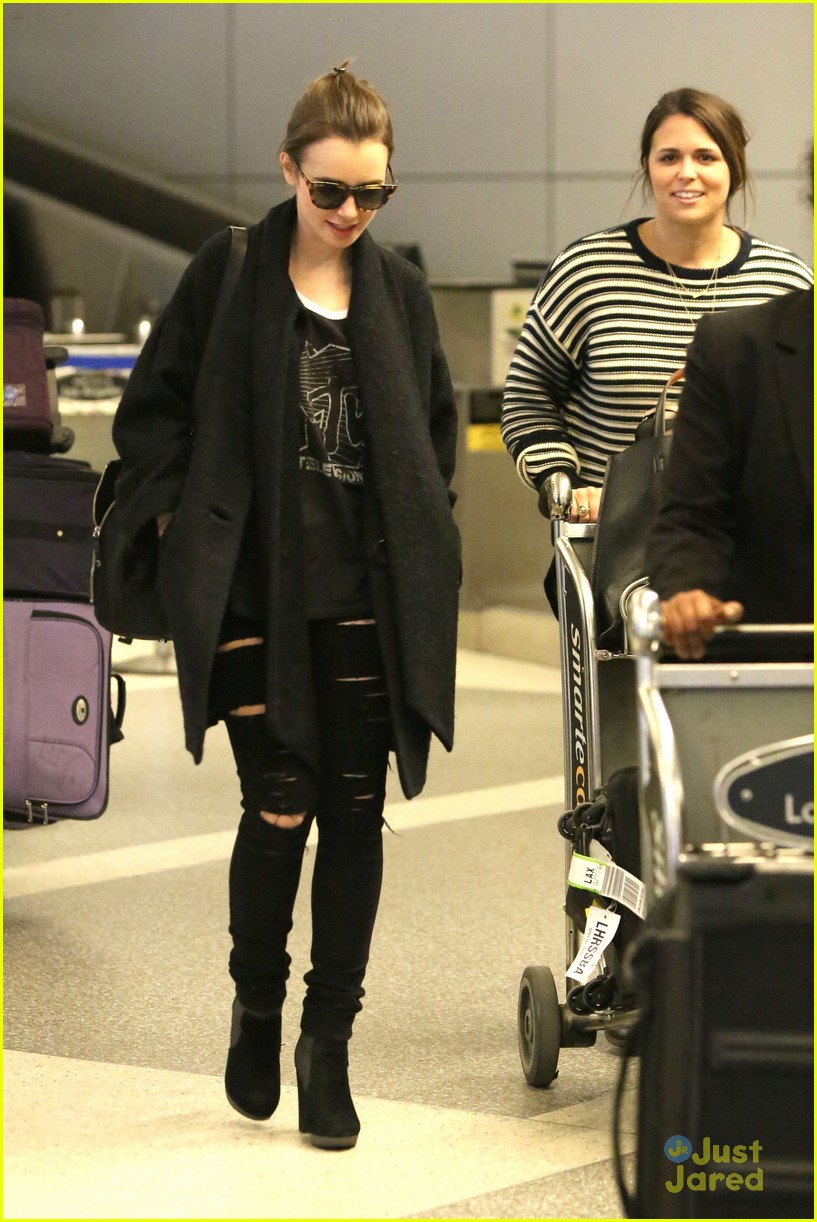 lily collins arrives lax after quick trip 09