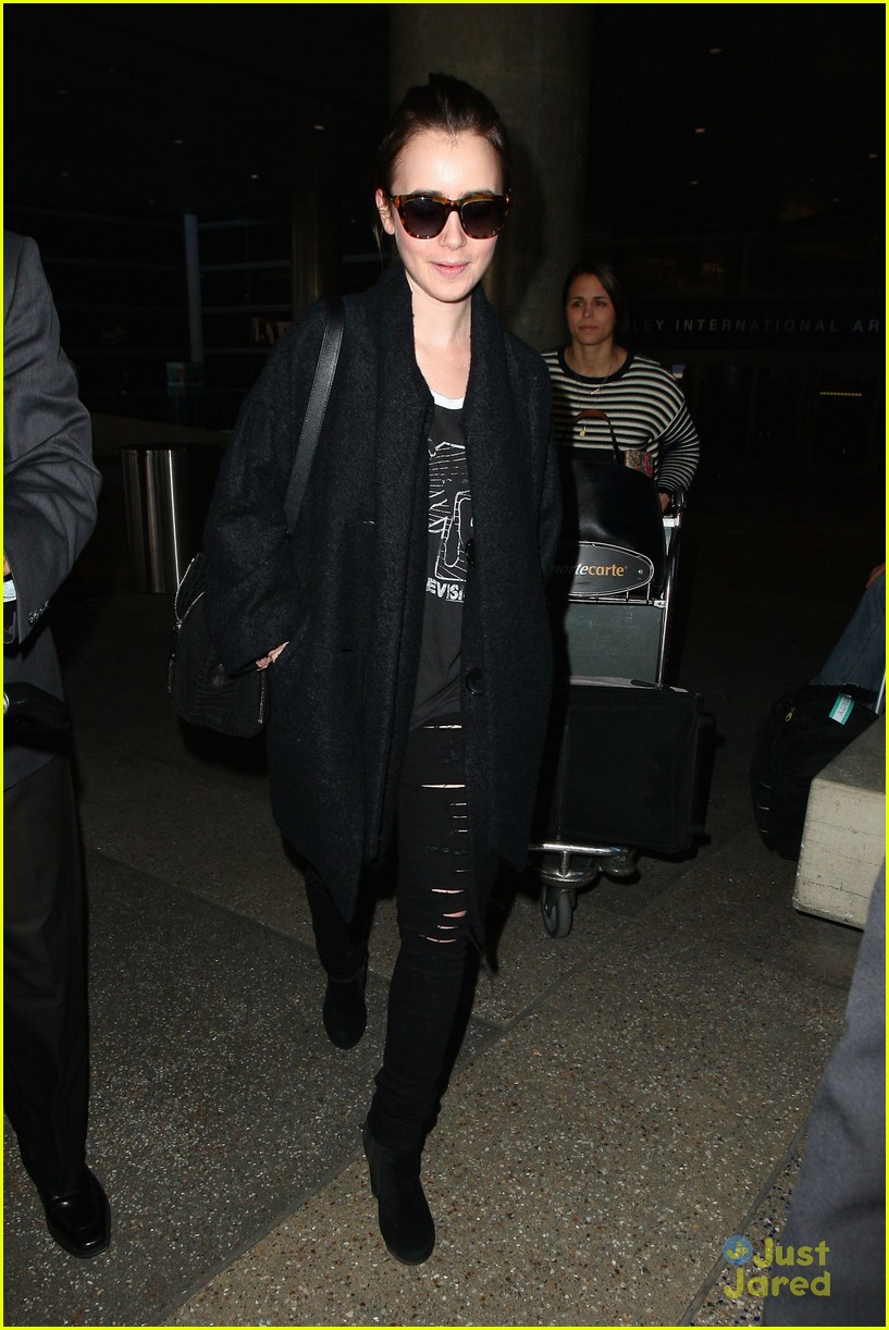 lily collins arrives lax after quick trip 10