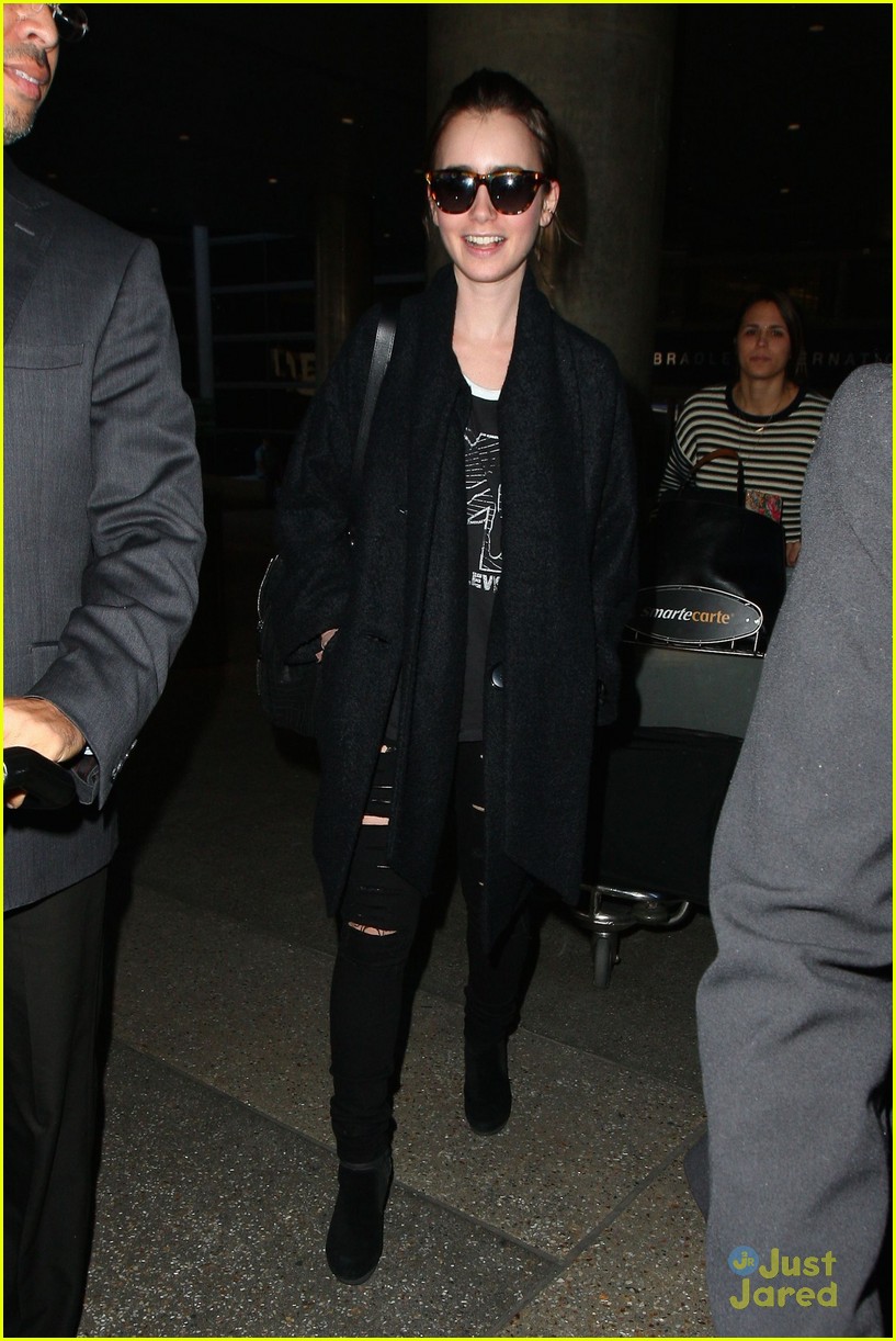 lily collins arrives lax after quick trip 15