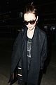 lily collins arrives lax after quick trip 01