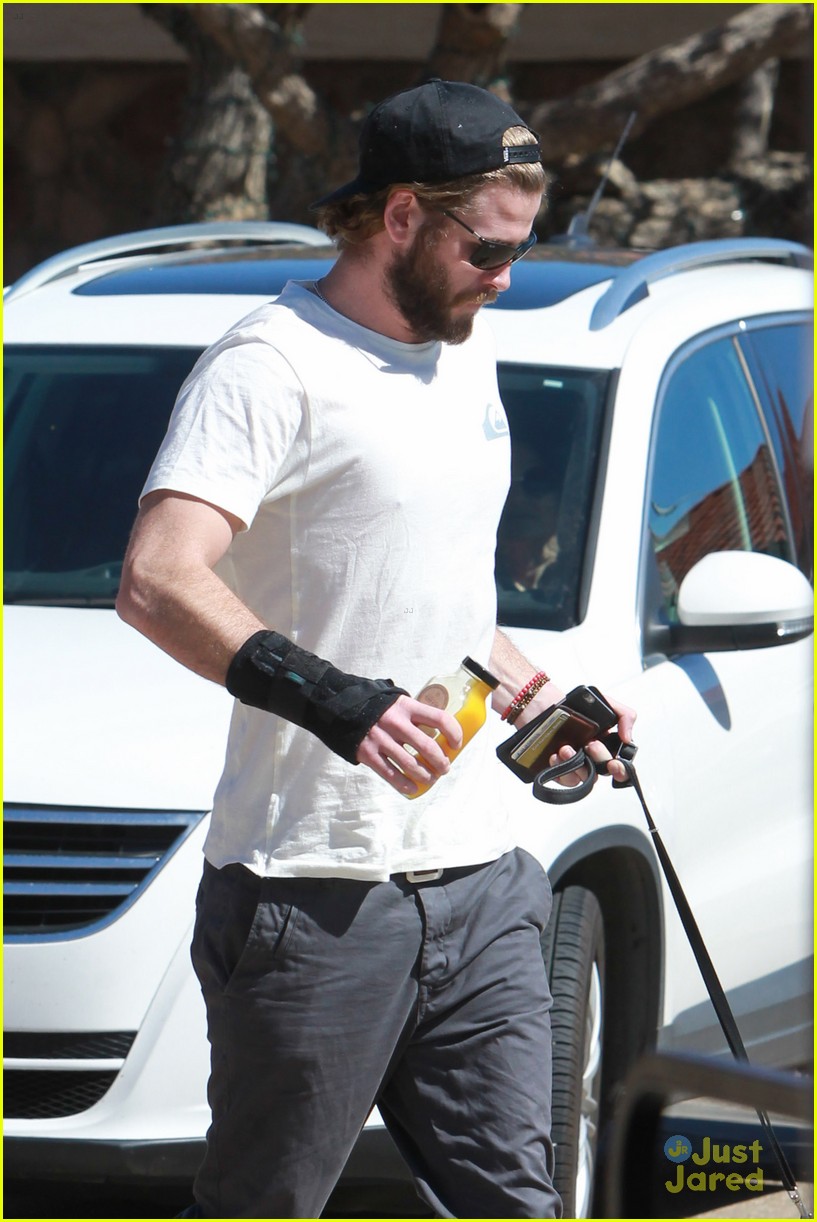 liam hemsworth pup out after independence day news 08