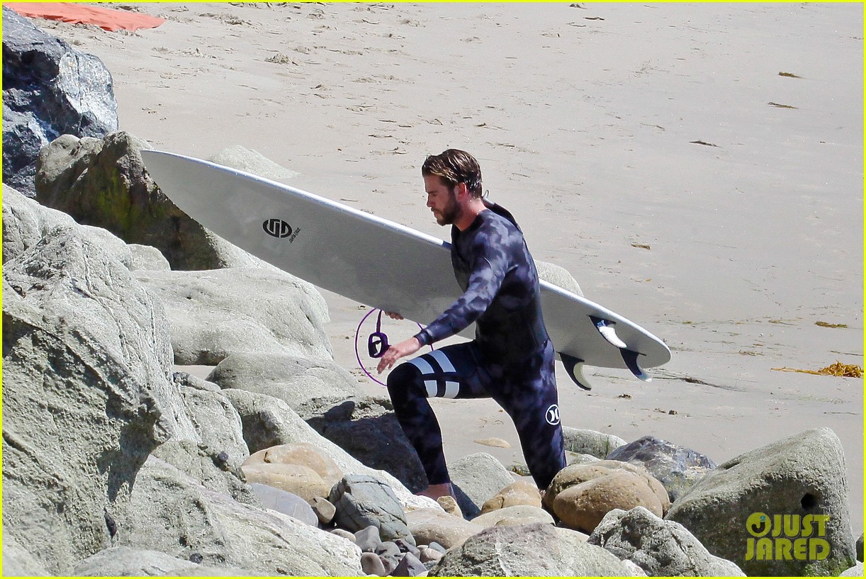 liam hemsworth wetsuit for surfing 11