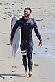 liam hemsworth wetsuit for surfing 01