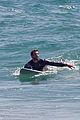 liam hemsworth wetsuit for surfing 03