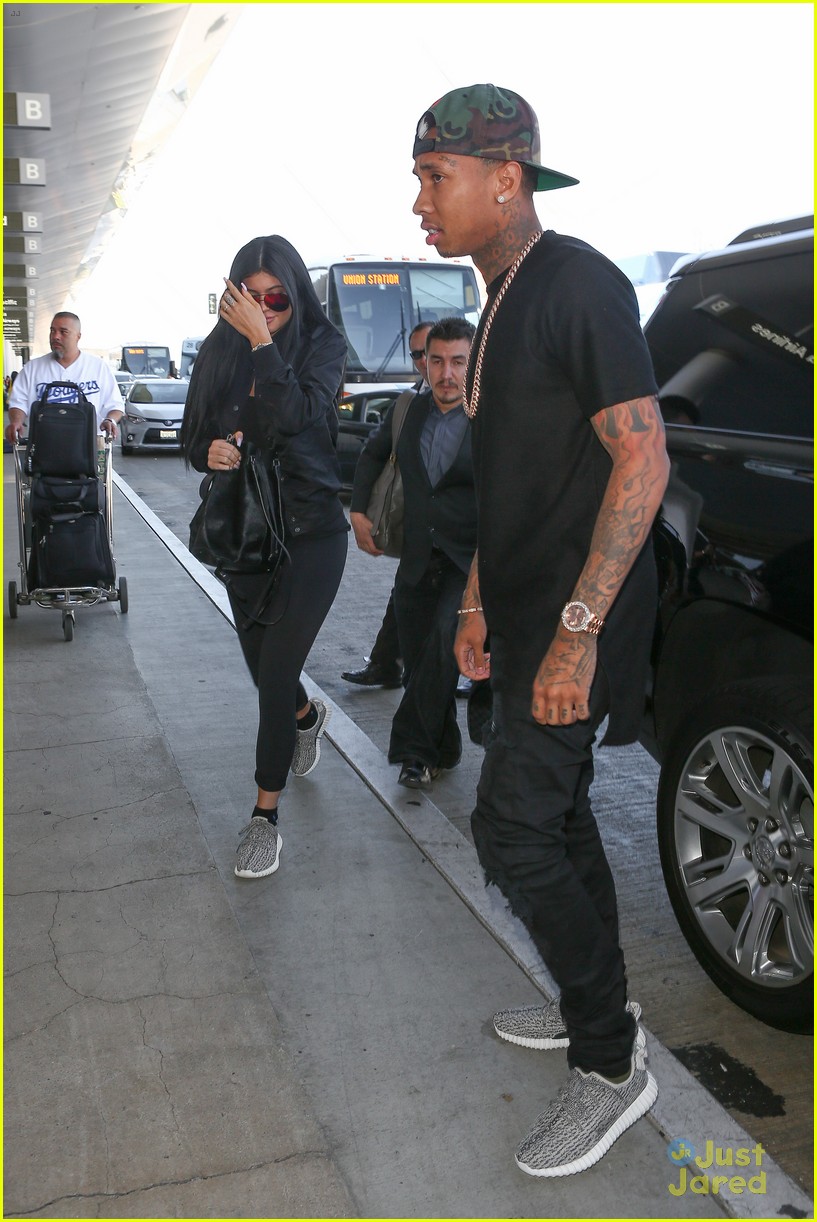 kylie jenner tyga coordinate outfits at lax airport 18