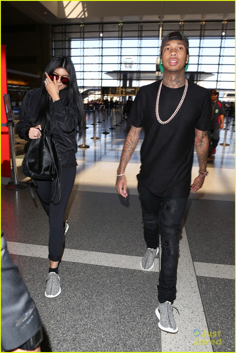 kylie jenner tyga coordinate outfits at lax airport 19