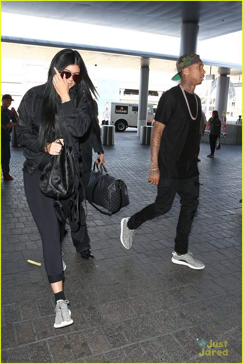 kylie jenner tyga coordinate outfits at lax airport 29