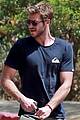 liam hemsworth flexes biceps on set for an upcoming skit 02