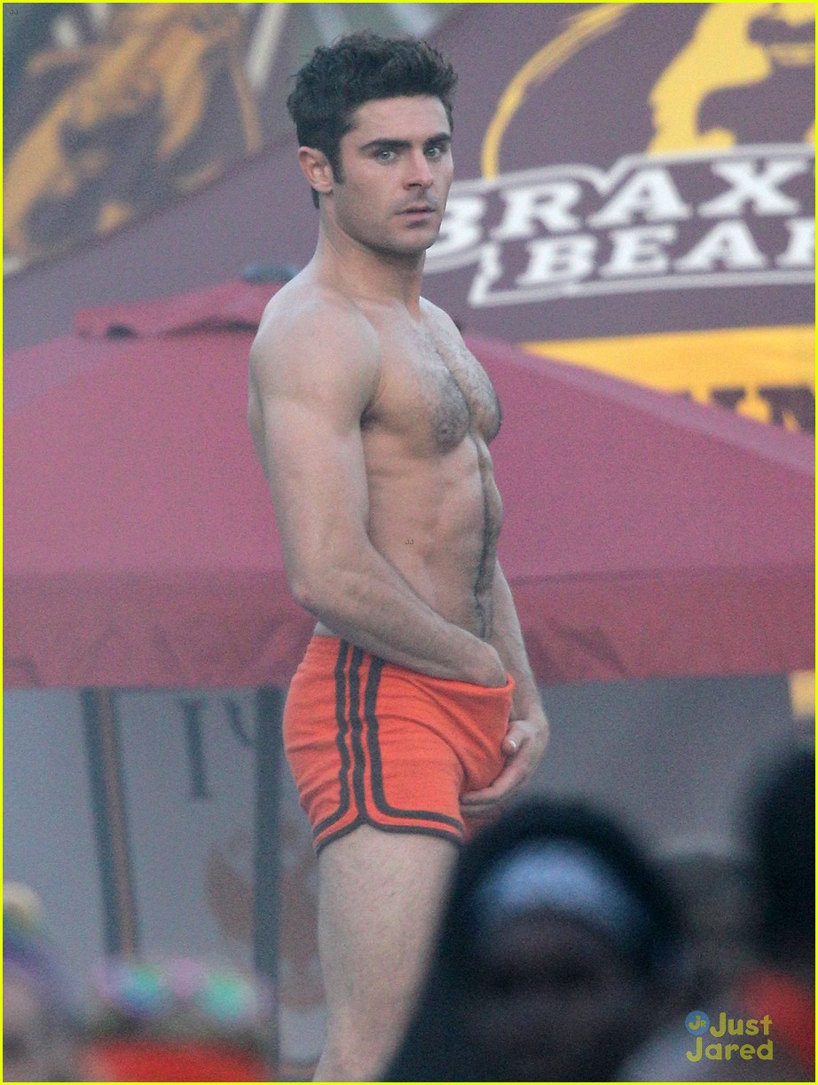 zac efron sticks hand in shorts flaunts eight pack abs 01