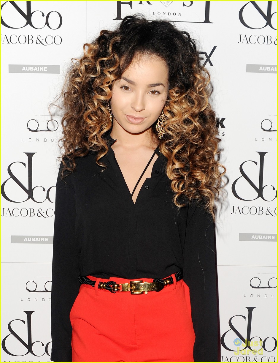 ella eyre looks her earrings over her face 01