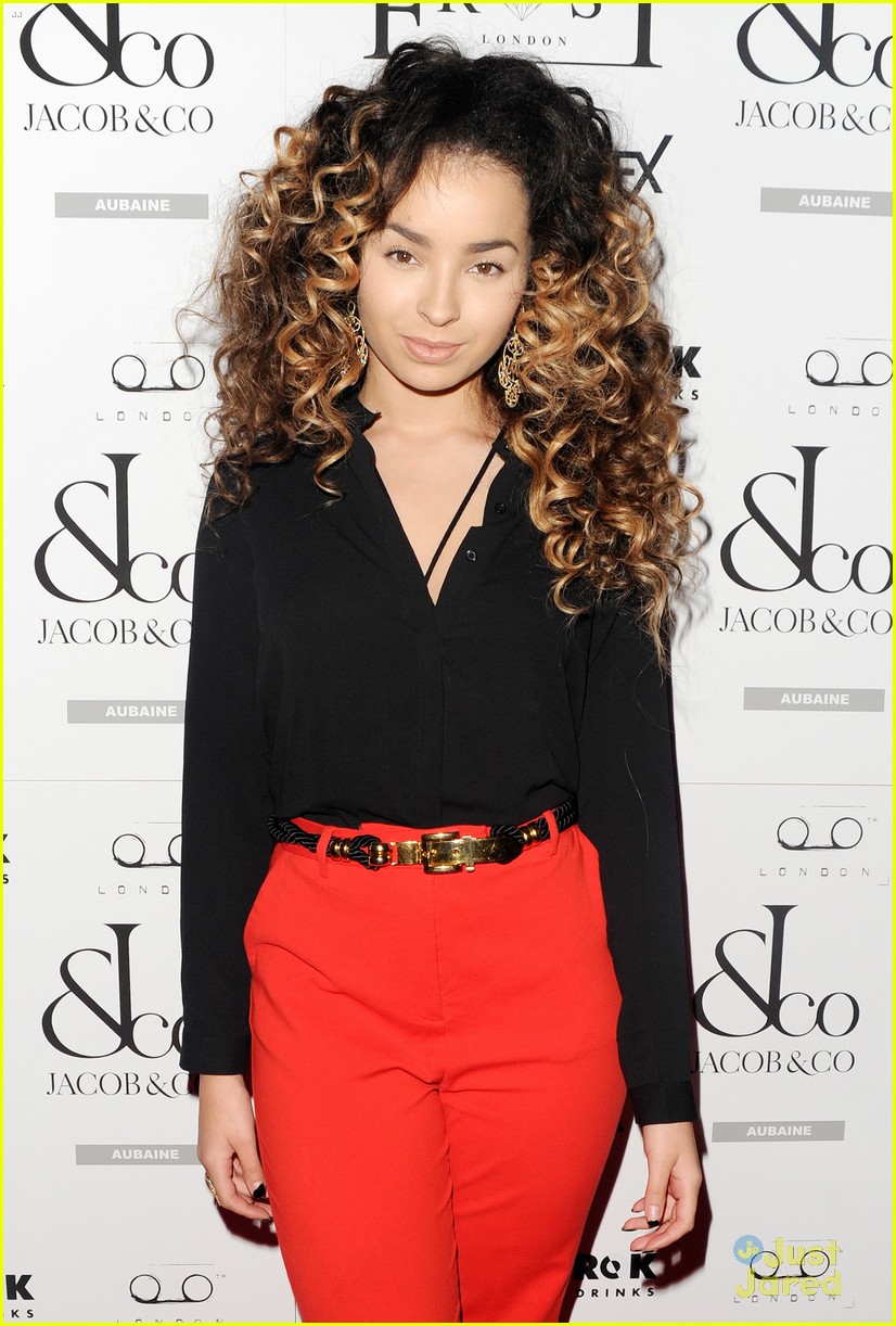 ella eyre looks her earrings over her face 07