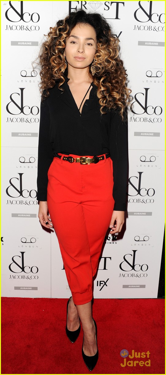 ella eyre looks her earrings over her face 11