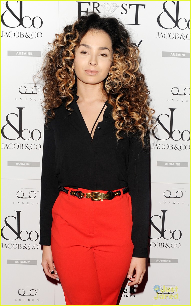 ella eyre looks her earrings over her face 13