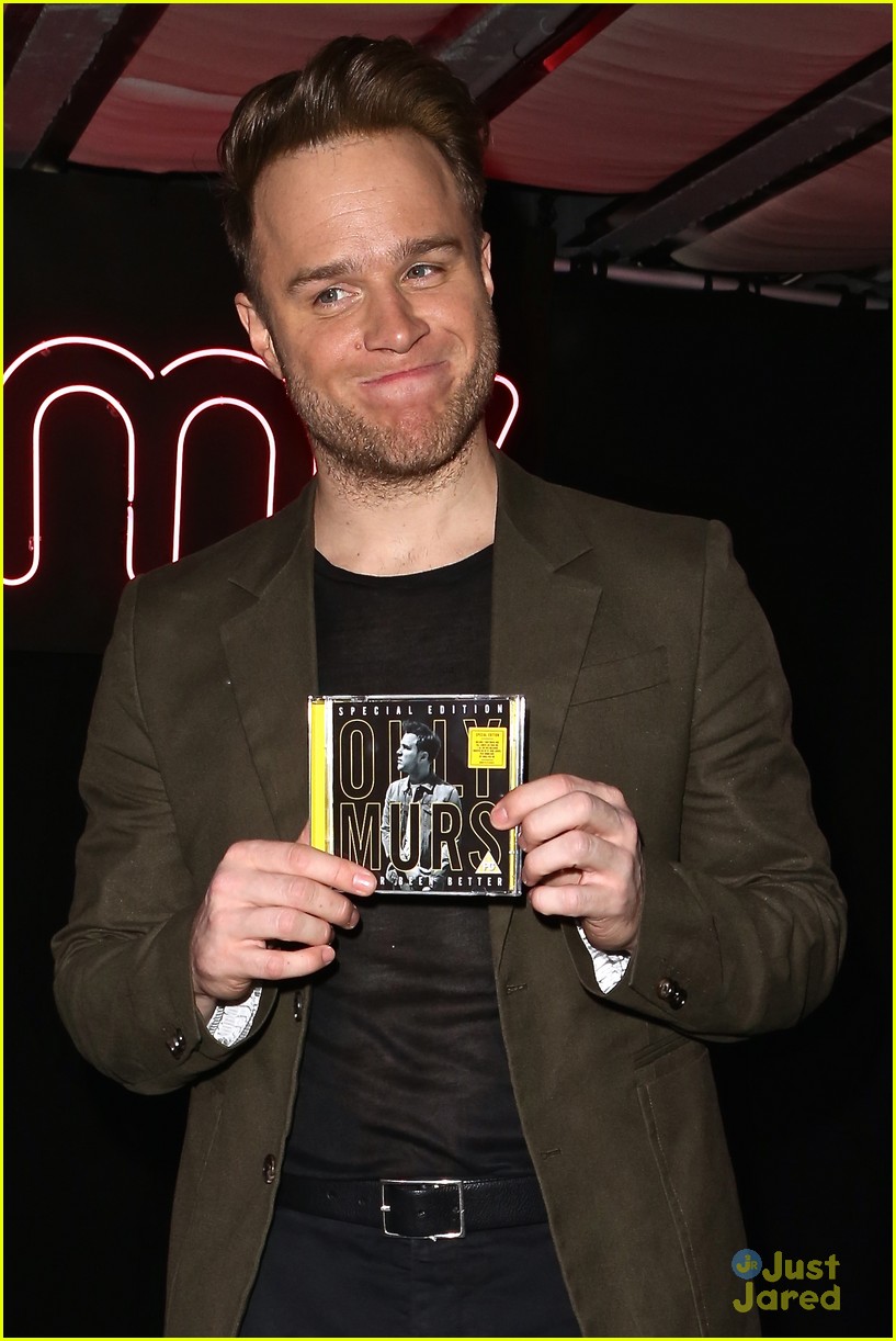 olly murs smirks while posing with special edition cd 02