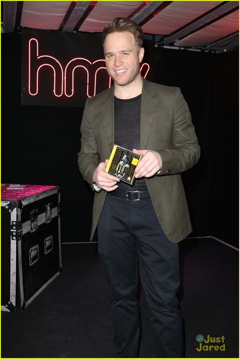 olly murs smirks while posing with special edition cd 05
