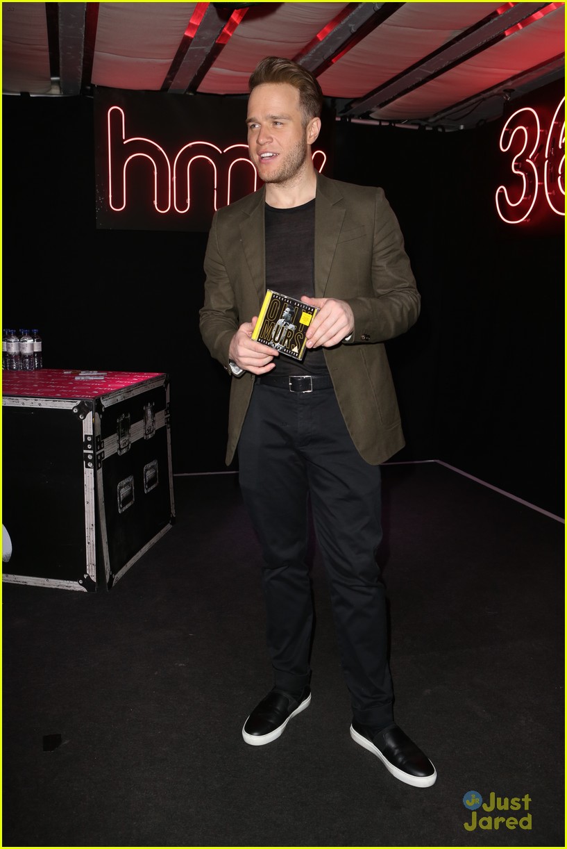 olly murs smirks while posing with special edition cd 12