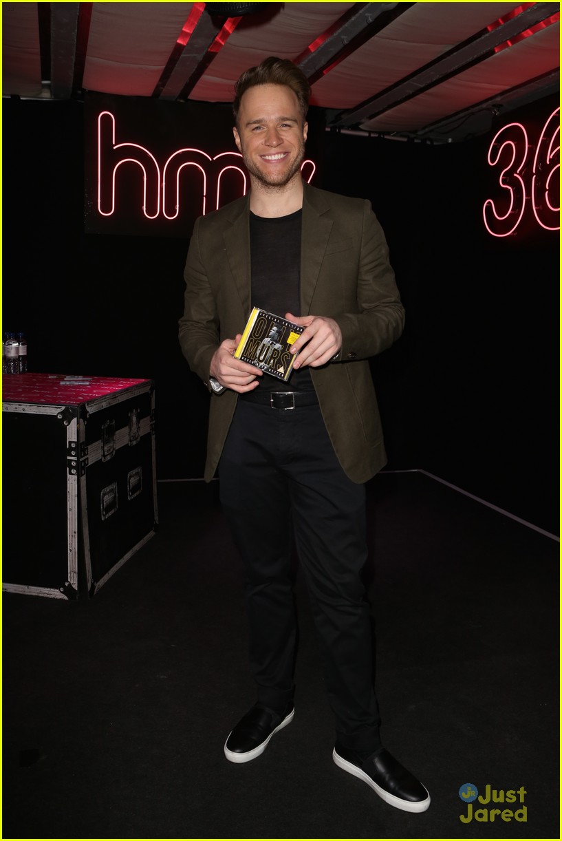 olly murs smirks while posing with special edition cd 14