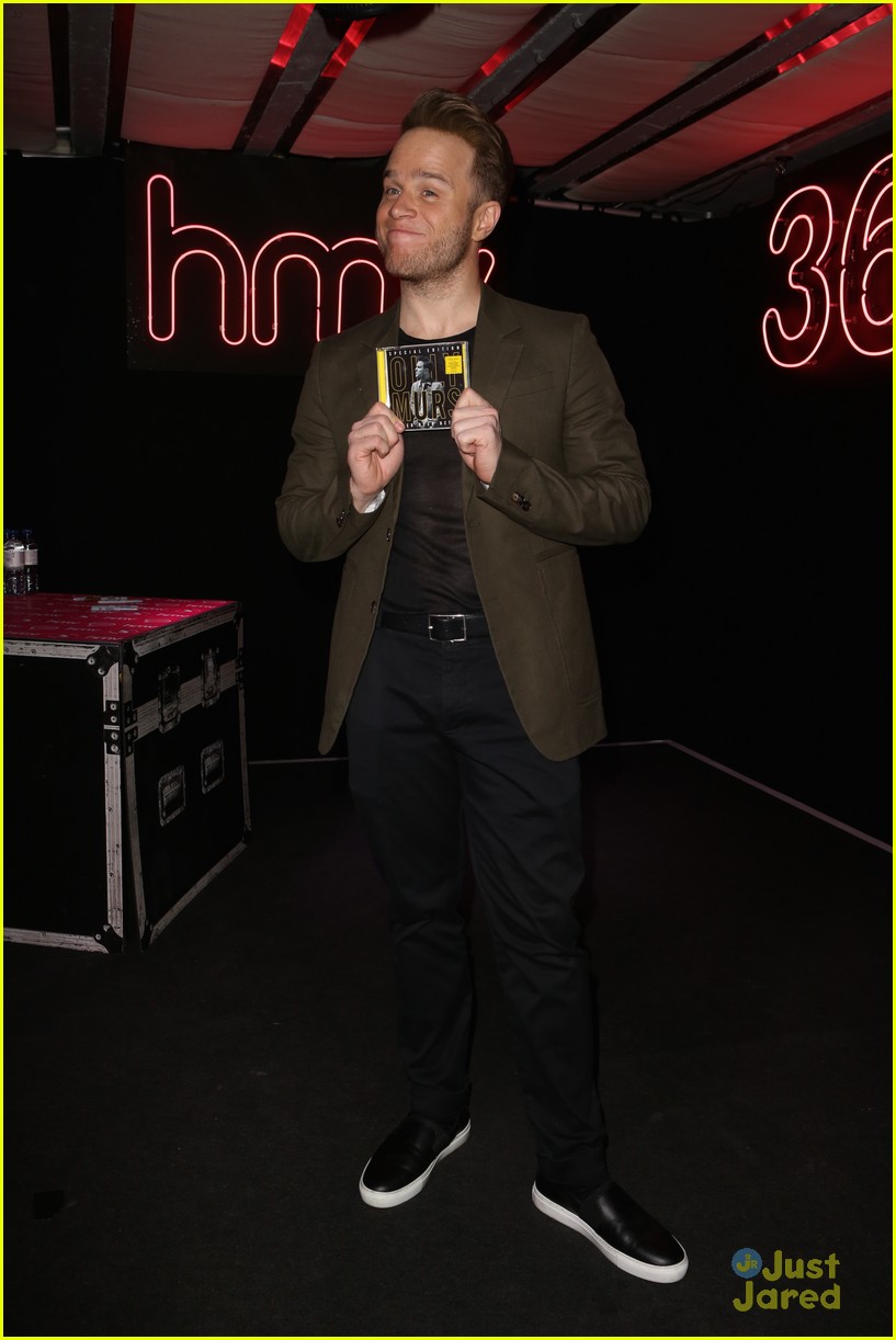 olly murs smirks while posing with special edition cd 15