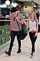 ashton irwin girlfriend bryana holly sydney airport 01