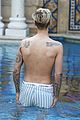 justin bieber goes shirtless for swim at versace mansion 03