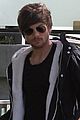 louis tomlinson steps out of hotel after sons birth 03