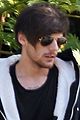 louis tomlinson steps out of hotel after sons birth 11
