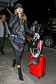 hailey baldwin pushes red carry on thru lax 01