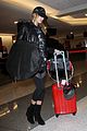 hailey baldwin pushes red carry on thru lax 03