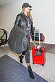 hailey baldwin pushes red carry on thru lax 04