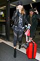 hailey baldwin pushes red carry on thru lax 08
