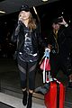 hailey baldwin pushes red carry on thru lax 12
