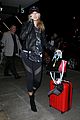 hailey baldwin pushes red carry on thru lax 13