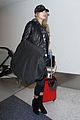 hailey baldwin pushes red carry on thru lax 14