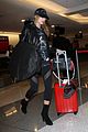 hailey baldwin pushes red carry on thru lax 16
