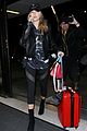hailey baldwin pushes red carry on thru lax 17