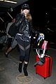 hailey baldwin pushes red carry on thru lax 19