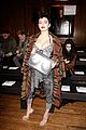 charlii xcx sports ironic purse during lfw 01