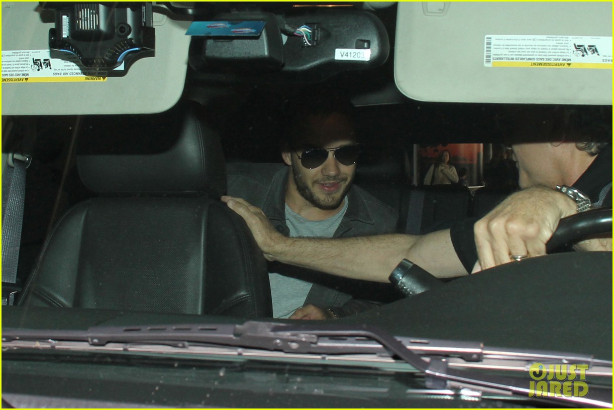 liam payne is bombareded by fans at airport 05