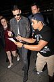 liam payne is bombareded by fans at airport 08