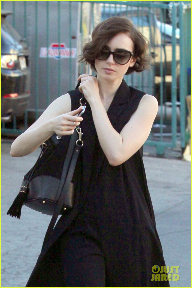 Lily Collins Arrives at LAX with a New Prada Bag - PurseBlog