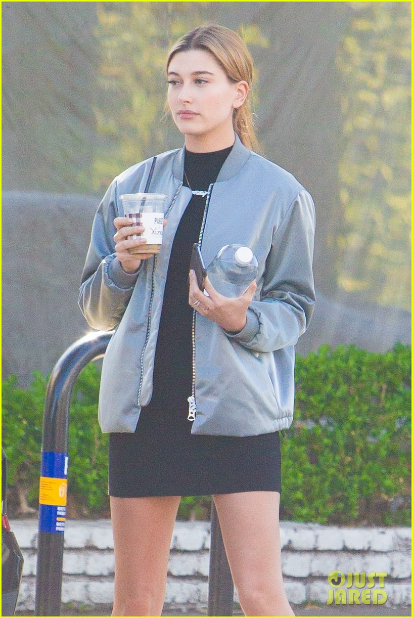 hailey baldwin holds sips on her coffee with her friend 21