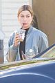 hailey baldwin holds sips on her coffee with her friend 01
