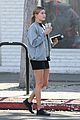 hailey baldwin holds sips on her coffee with her friend 02