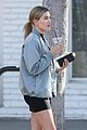 hailey baldwin holds sips on her coffee with her friend 03