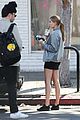 hailey baldwin holds sips on her coffee with her friend 04