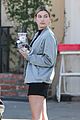 hailey baldwin holds sips on her coffee with her friend 05