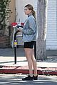 hailey baldwin holds sips on her coffee with her friend 17